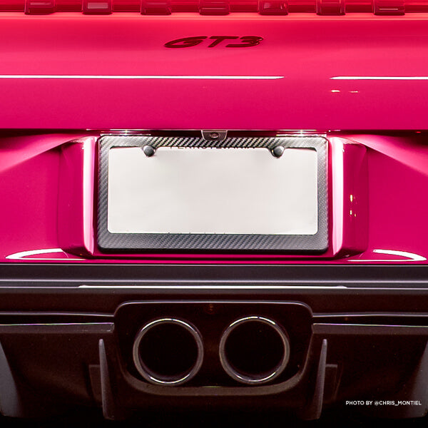 Pink Porsche GT3 with carbon fiber license plate frame