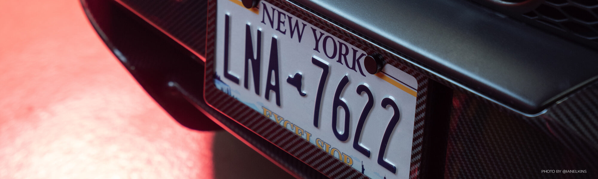Carbon fiber license plate frame on a McLaren Artura
