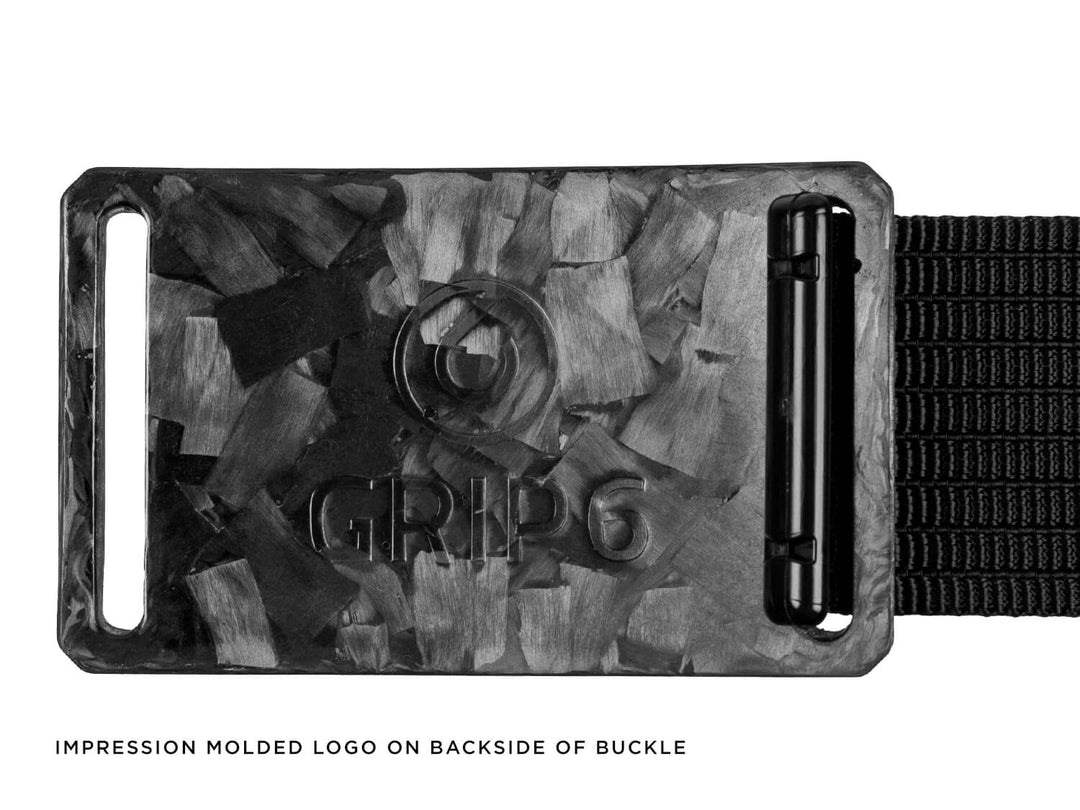 Impression molded logo on back side of forged carbon fiber belt buckle