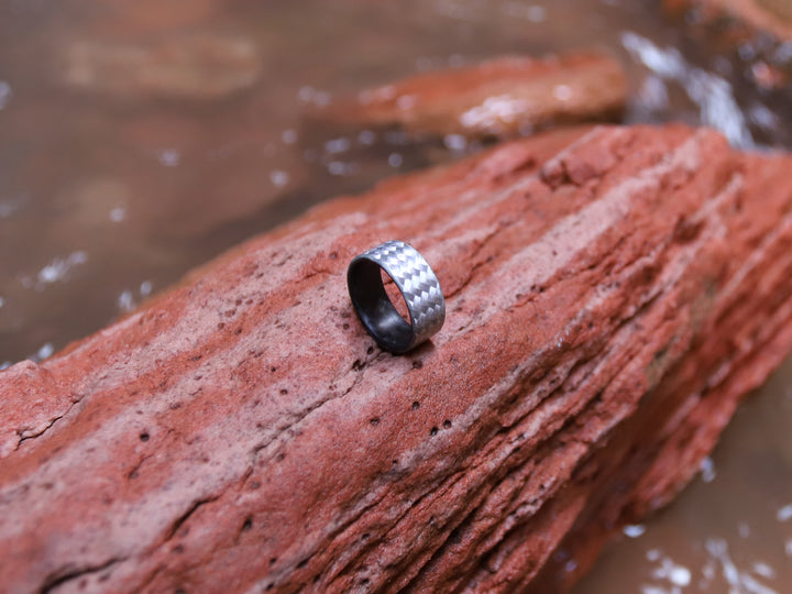 Silverback ring on wood in water