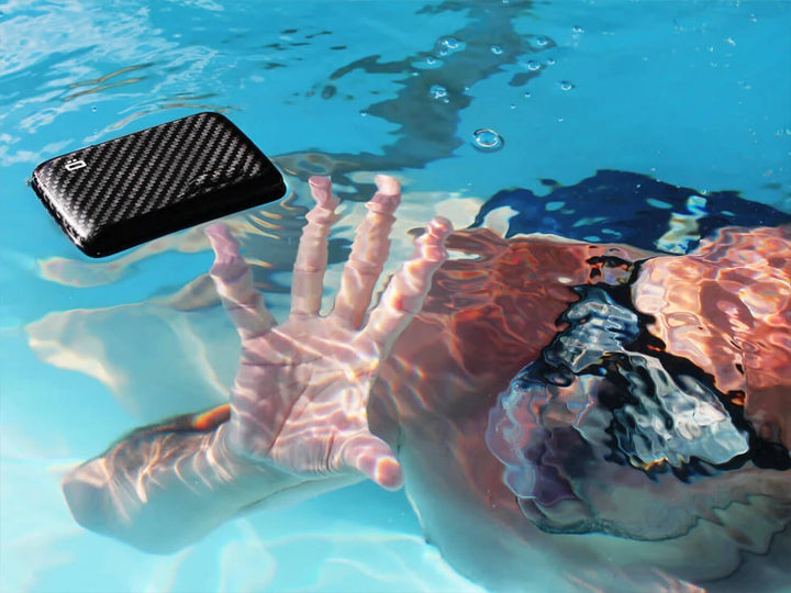 Ogon Smart Case V2 (formerly Stockholm V2) carbon fiber wallet in a pool