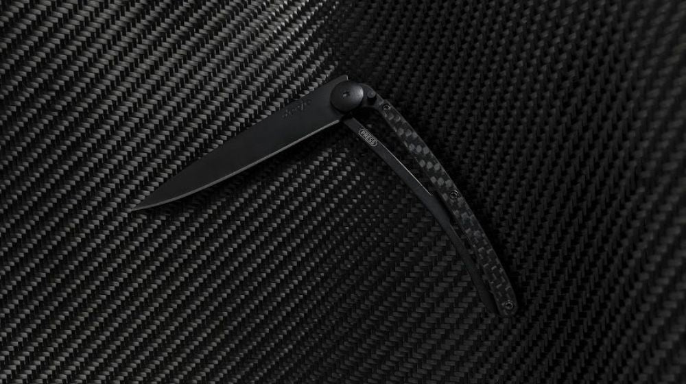 Deejo 37G Knife with Solid Carbon Fiber Handle in black carbon fiber background | Feature | Carbon Fiber Knife Styles For 2021
