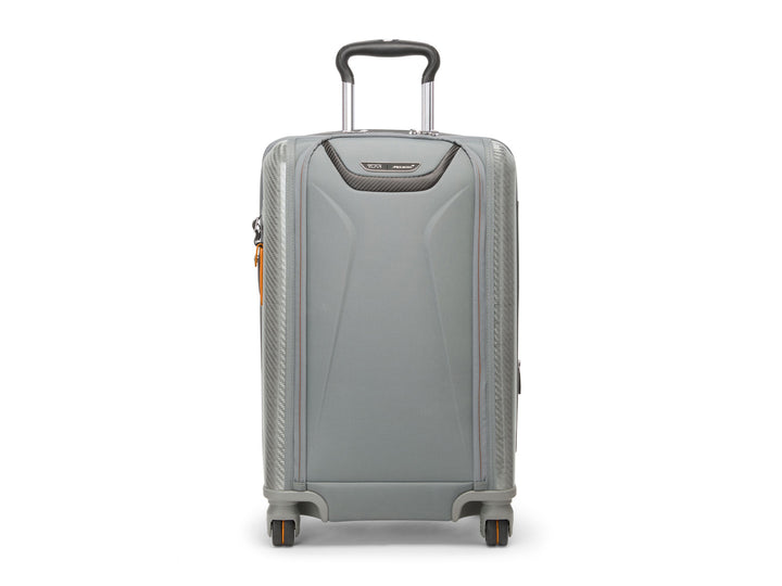 Front view of TUMI McLaren Aero carry-on in Super Grey showing carbon fiber accents and telescoping handle