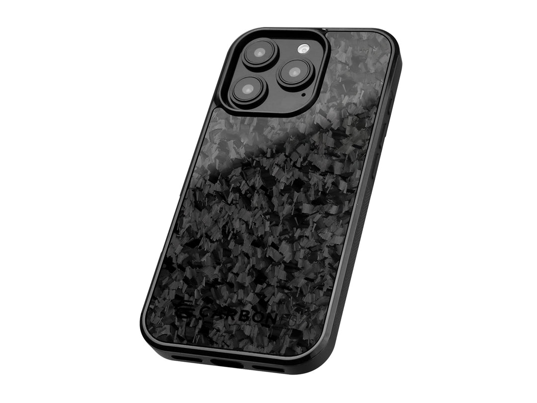 Premium iPhone case at an angle highlighting the distinctive forged carbon fiber texture and raised camera protection ring