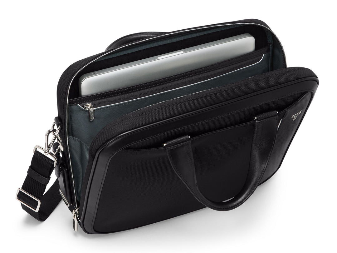 TUMI Hannover brief open showing quilted 14-inch laptop compartment and interior organization pockets