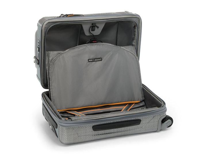 Interior view of Aero carry-on showing expandable main compartment with removable suiter and Papaya orange trim