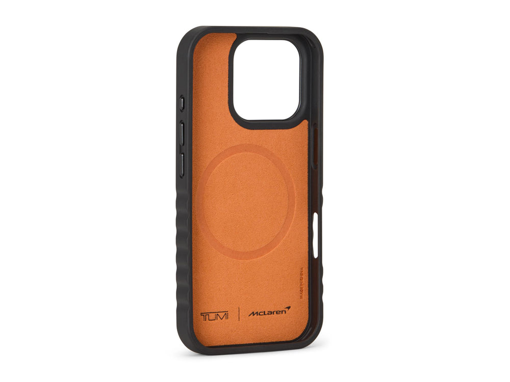 Inside view of TUMI x McLaren iPhone 16 Pro case showing papaya microfiber lining and MagSafe ring