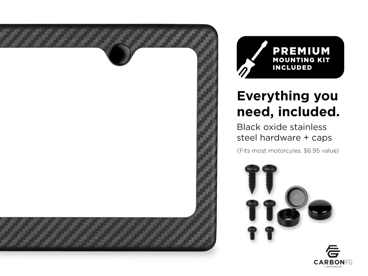Carbon fiber license plate frame with included black oxide stainless steel hardware and caps, shown with premium mounting kit contents