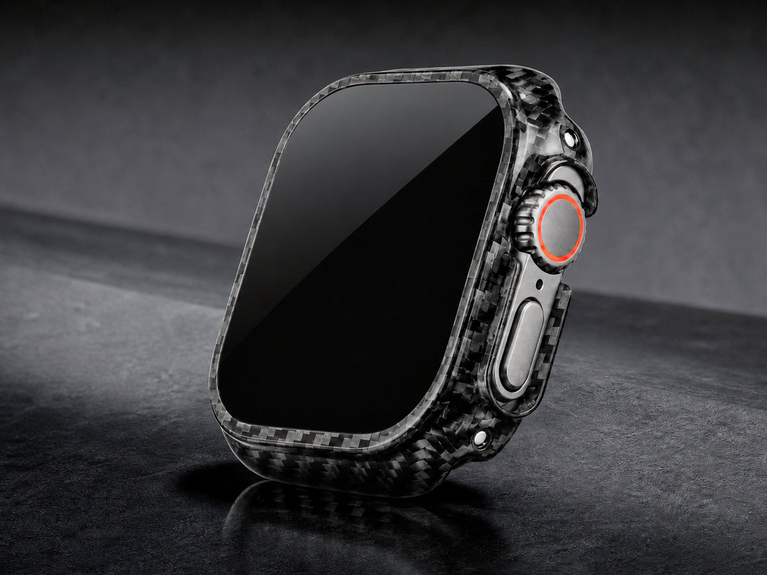 CarbonFG CarboShield carbon fiber bumper case installed on Apple Watch Ultra, dramatic angled view on dark surface