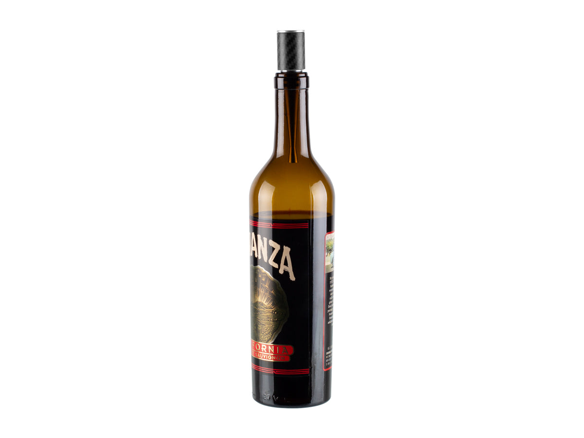 Farfalli Carbon Fiber Wine Stopper in use, sealing a wine bottle, demonstrating its practicality and stylish appearance.