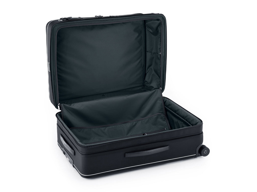 TUMI Arrivé suitcase fully open showing split-case dual access entry with zip divider and pockets