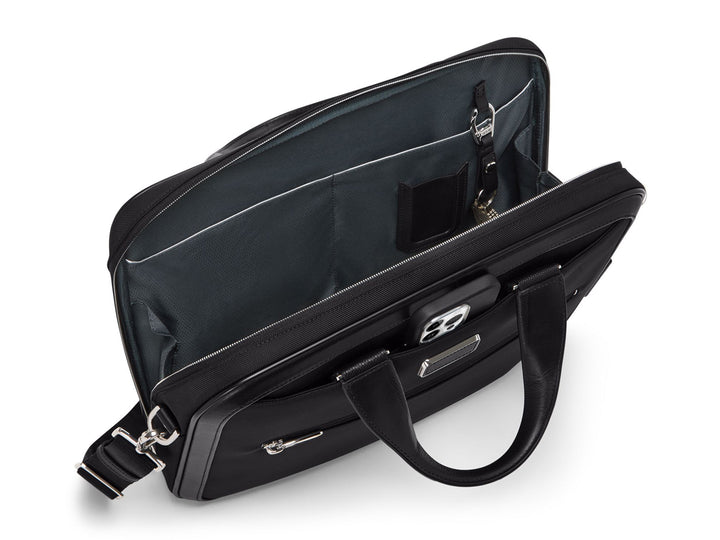 TUMI Arrivé brief interior detail showing slip pockets, pen loop, key fob, and organizational compartments