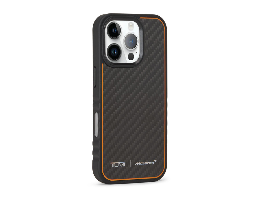 Angled view of TUMI x McLaren iPhone 16 Pro case highlighting carbon fiber inlay and orange edge detail