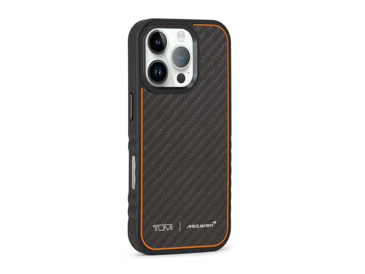 Angled view of TUMI x McLaren iPhone 16 Pro case highlighting carbon fiber inlay and orange edge detail