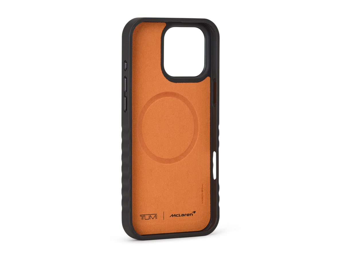 Angled view of TUMI x McLaren iPhone 16 Pro Max case highlighting carbon fiber inlay and orange edge detail