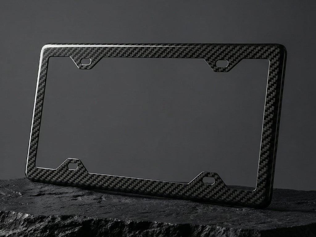Carbon fiber license plate frame on a dark background