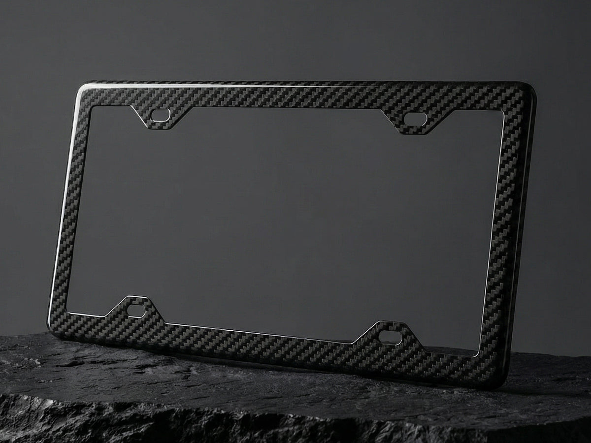 Carbon fiber license plate frame on a dark background