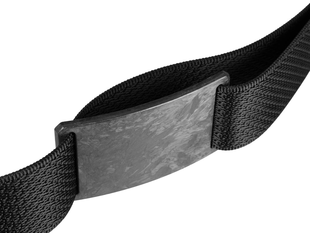 Angled side view of the Grip6 forged carbon fiber belt showing the marbled texture of the buckle and durable black nylon strap.