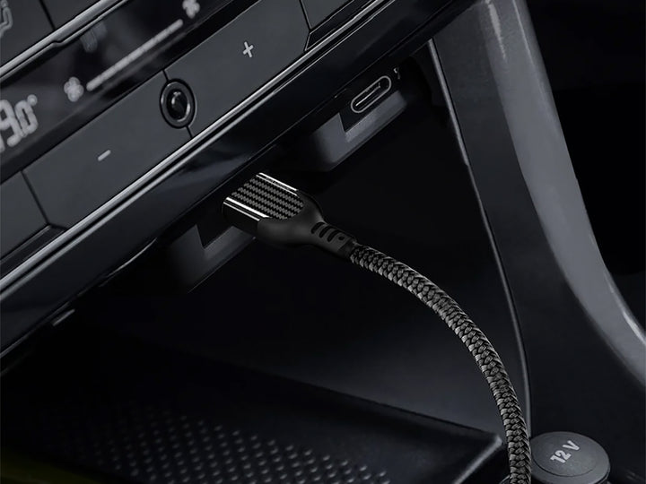 Carbon fiber usb-c to usb-c fast charge cable plugged into vehicle