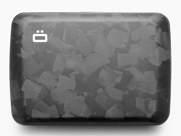 Top-down view of a forged carbon fiber wallet with matte finish and marbled pattern, featuring the Ögon logo.