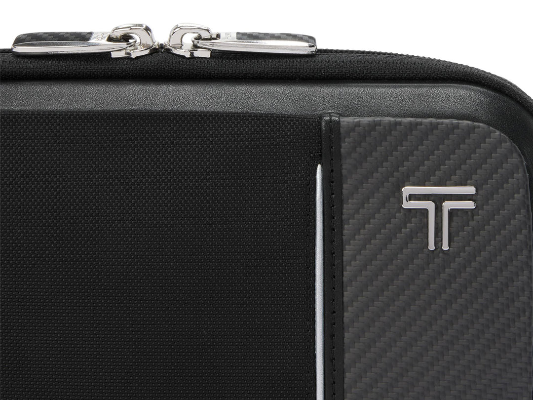 Close-up of American-made CX6 carbon fiber weave panel with TUMI logo on Messina sling bag