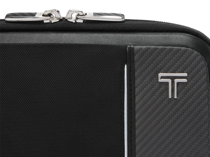 Close-up of American-made CX6 carbon fiber weave panel with TUMI logo on Messina sling bag