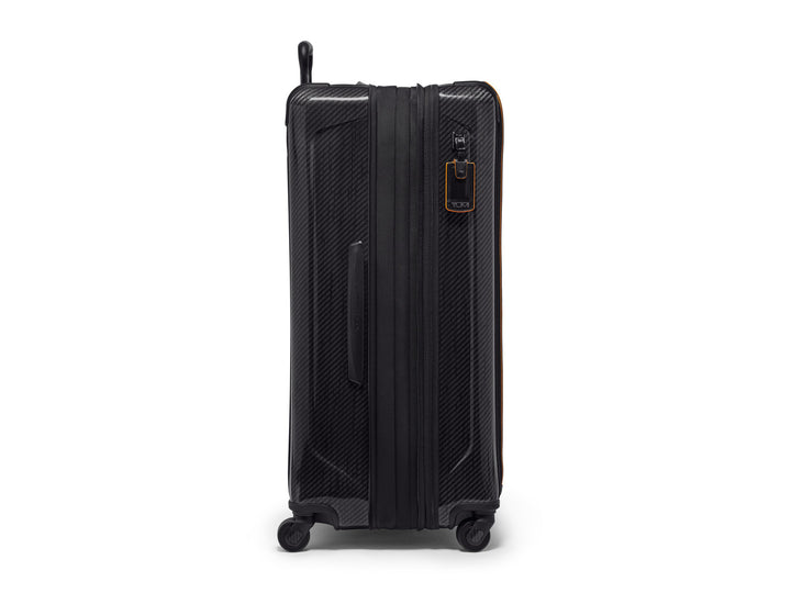 Side view of TUMI | McLaren Aero Extended Trip Packing Case with retractable handle and spinner wheels.