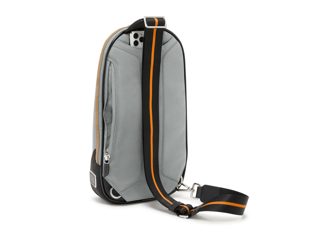 Back view of Torque Sling with vertical zip pocket and McLaren signature orange-striped strap