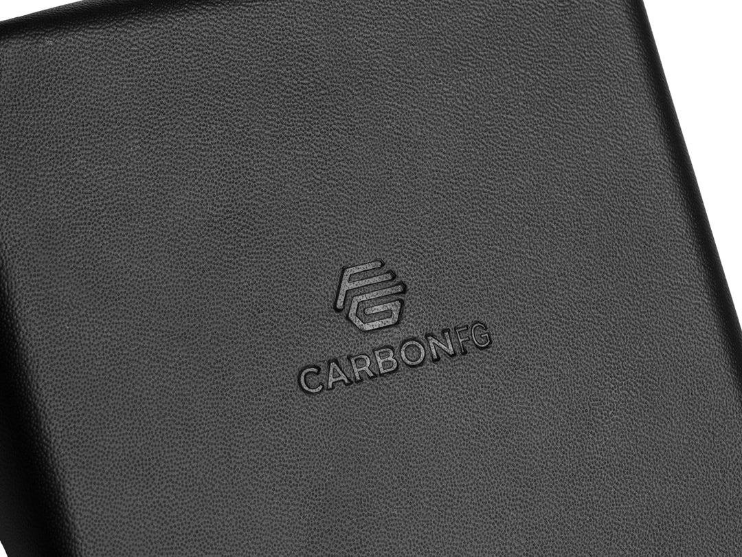 CarbonFG logo subtly stamped on the bottom of the leather valet tray, demonstrating the brand's attention to detail.