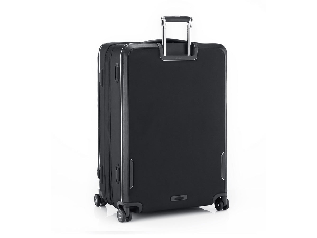 TUMI Arrivé 29-inch packing case rear view showing telescoping handle and dual outboard wheels