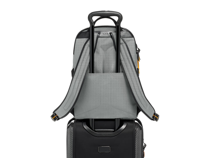 Back view of TUMI McLaren Velocity backpack demonstrating Add-a-Bag sleeve with luggage handle