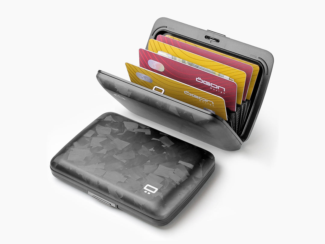 Forged carbon fiber wallet shown open with colorful cards in fan layout, highlighting internal organization and RFID-blocking design.