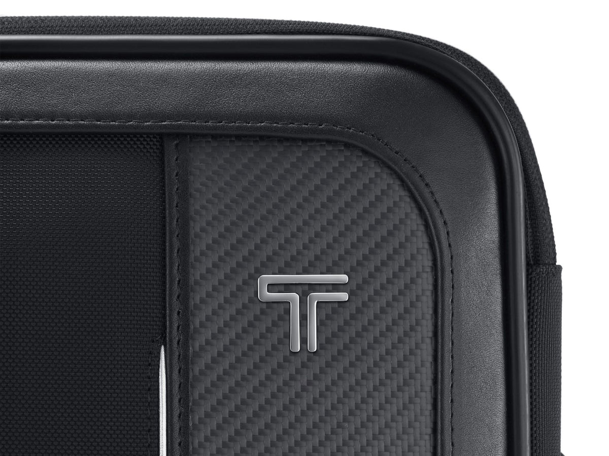 Close-up of American-made CX6 carbon fiber weave panel with TUMI logo on Arrivé luggage