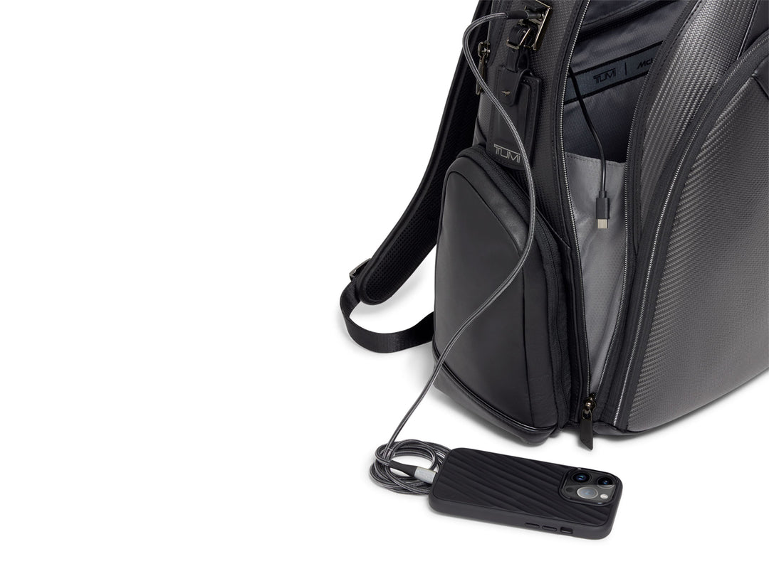 TUMI x McLaren backpack with built-in USB cable for charging devices on-the-go.
