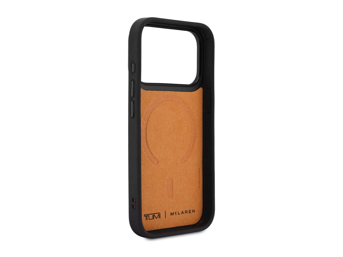 Inside of the TUMI x McLaren iPhone 18 Pro case, papaya microfiber lining with the MagSafe ring pressed in