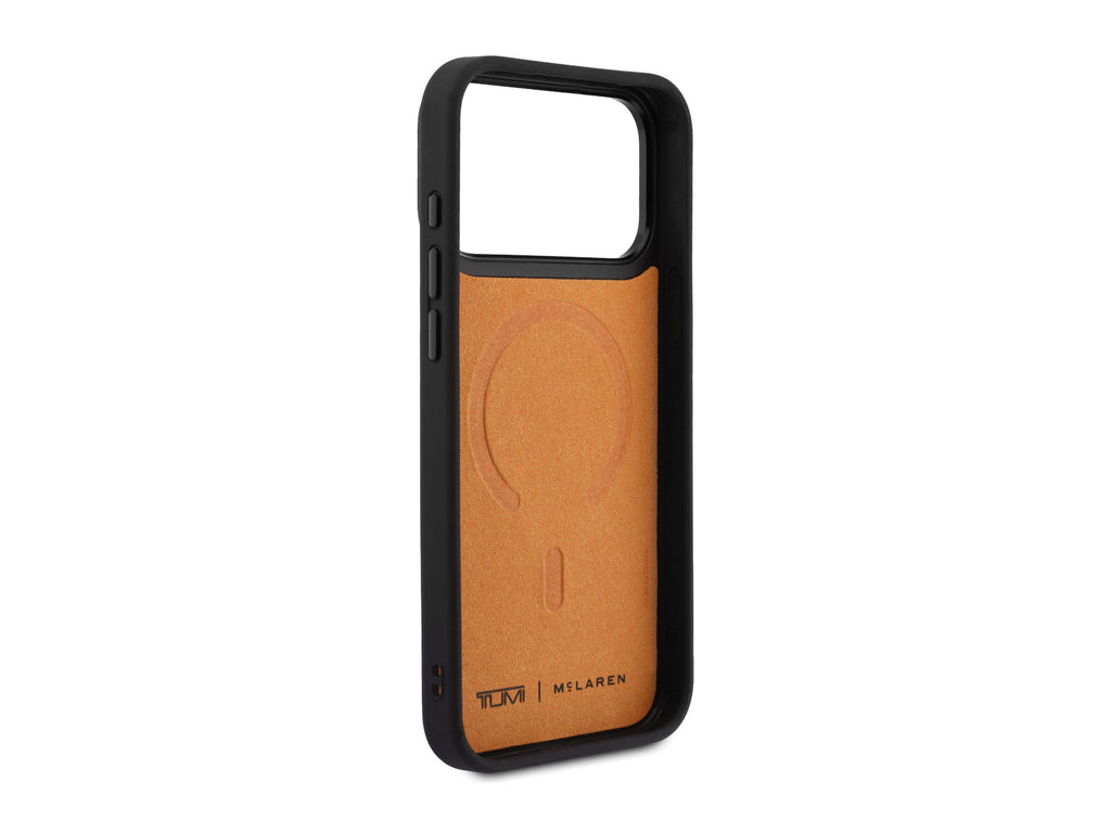 Inside of the TUMI x McLaren iPhone 18 Pro Max case, papaya microfiber lining with the MagSafe ring pressed in