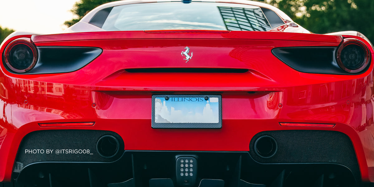 Carbon fiber license plate frame on red Ferrari
