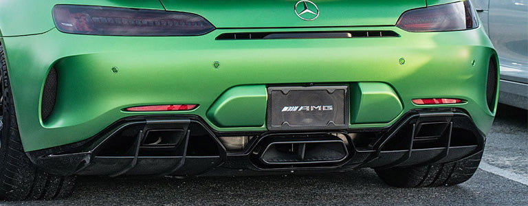 Green Mercedes AMG GT with carbon fiber license plate frame