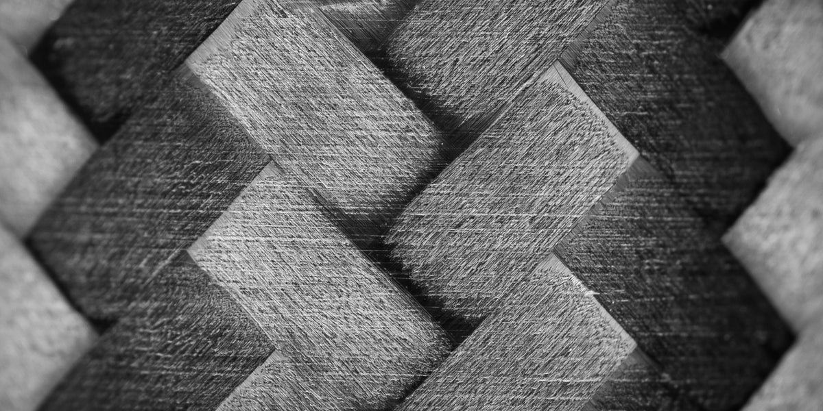 Close-up of woven fabric with a herringbone pattern