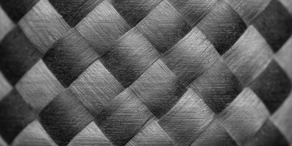 Close-up of a woven pattern with black and gray tones