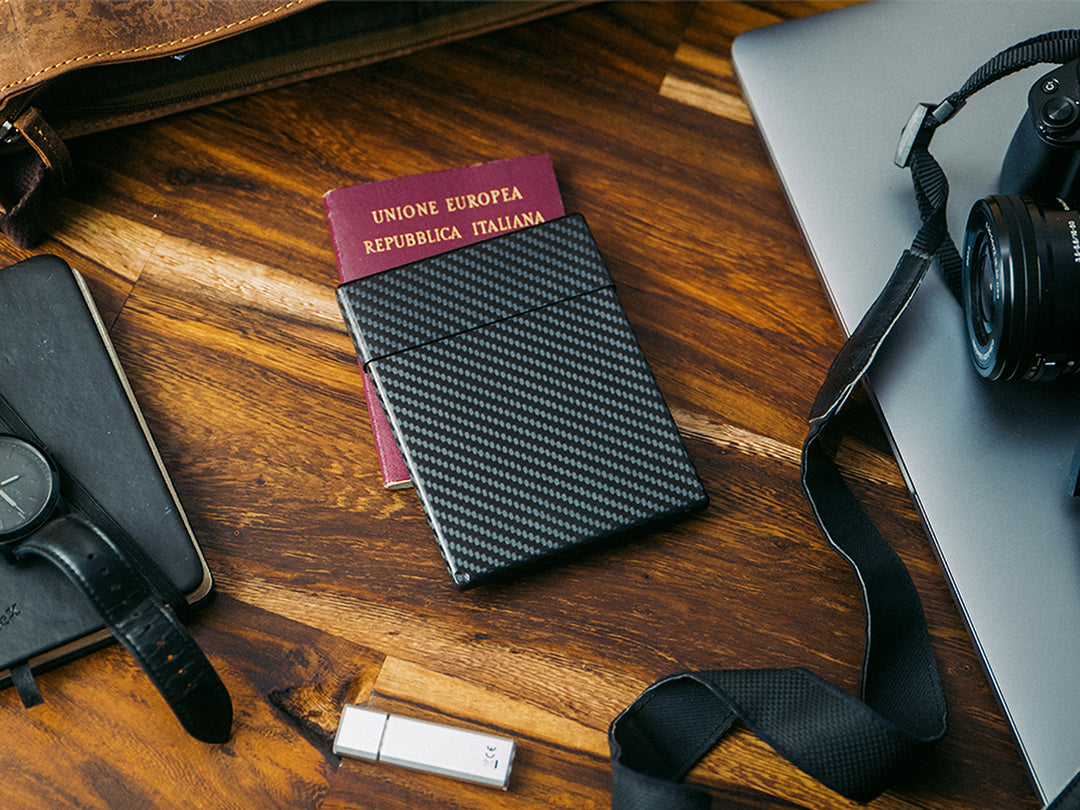 Carbon fiber passport case, lifestyle on desk
