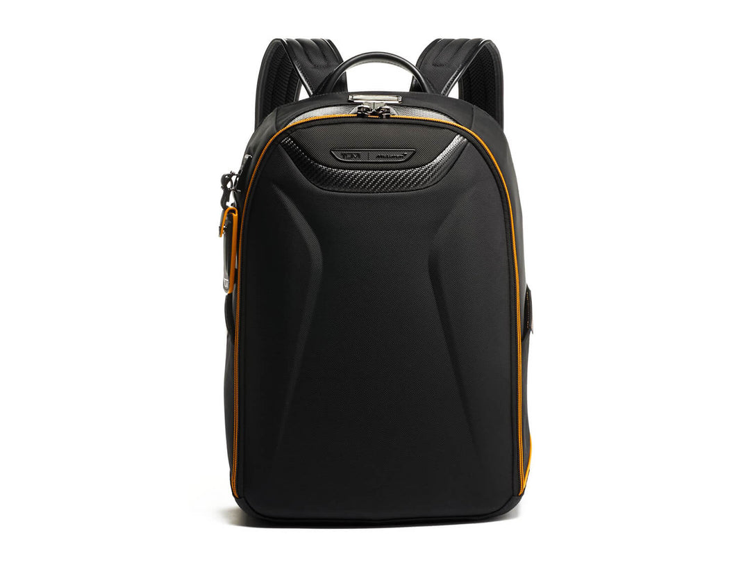 Front view of TUMI | McLaren Velocity Backpack with sleek black design and McLaren's signature Papaya accents.