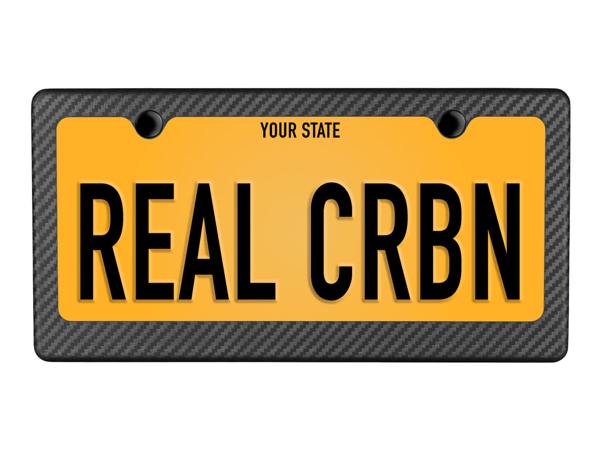 Sample plate display showcasing understated matte carbon fiber frame with 1-inch lower border