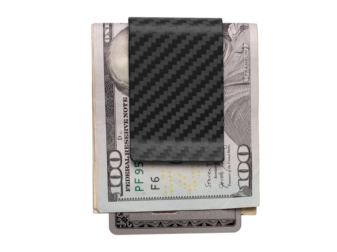 Carbon fiber money clip with a matte finish, holding cash and cards, front