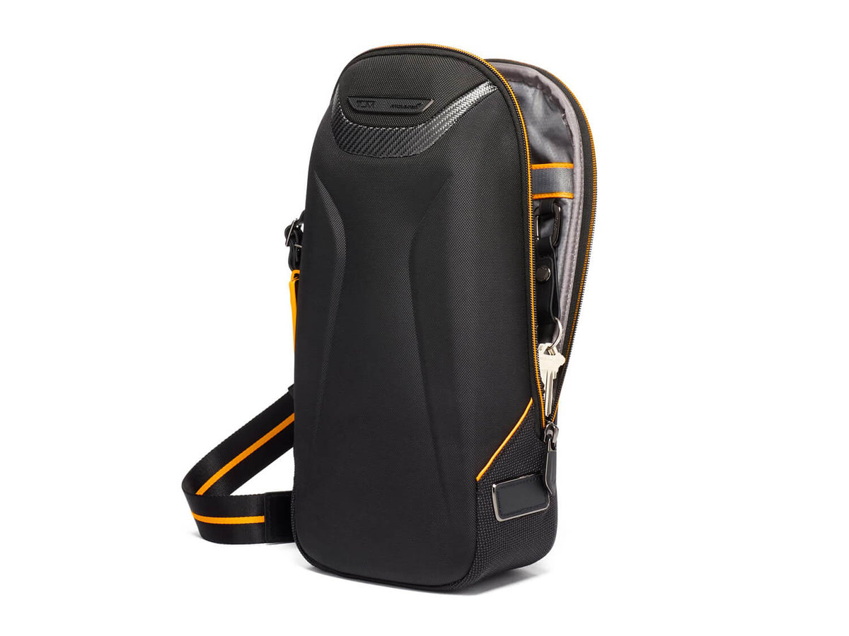 TUMI | McLaren Torque Sling, side open#color_black-with-papaya
