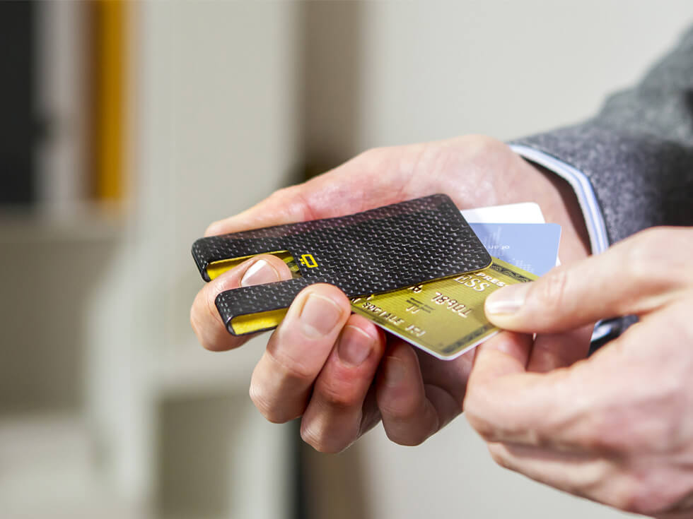 Ogon 3C Carbon Fiber RFID Blocking Card Clip, lifestyle in hand