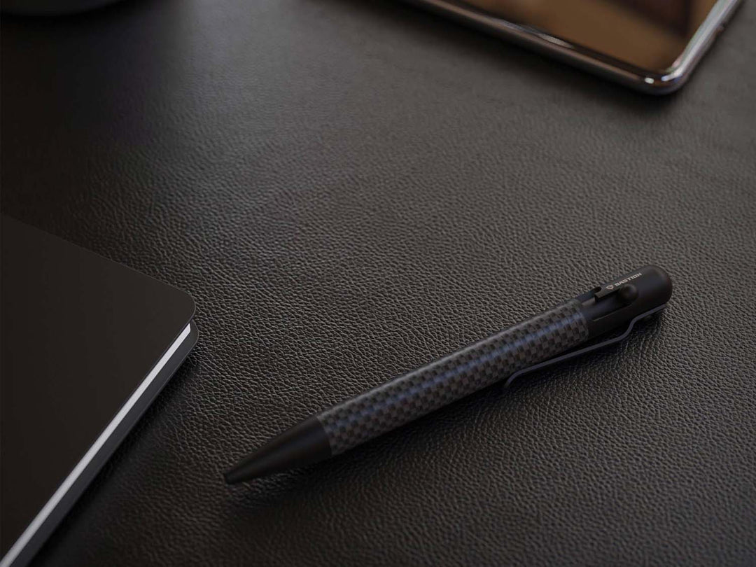 Bastion Blackout Bolt-Action Carbon Fiber Pen, on desk