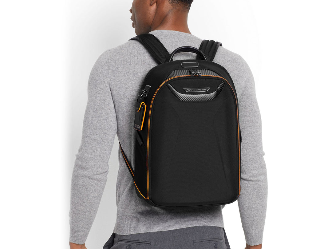 Model wearing TUMI | McLaren Velocity Backpack, illustrating the backpack's comfortable fit and modern aesthetic.